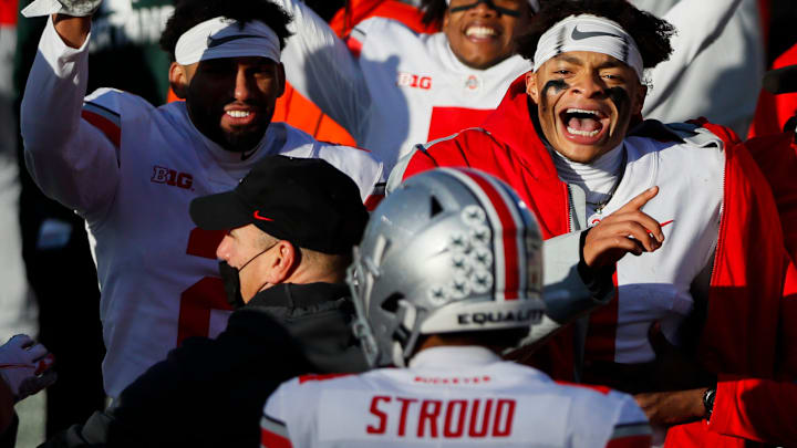 Ohio State Buckeyes quarterback Justin Fields (1) celebrates a rushing touchdown from fellow quarterback C.J. Stroud (14) during the fourth quarter of a NCAA Division I football game between the Michigan State Spartans and the Ohio State Buckeyes on Saturday, Dec. 5, 2020 at Spartan Stadium in East Lansing, Michigan.

Cfb Ohio State Buckeyes At Michigan State Spartans