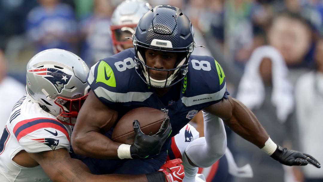 Sep 9, 2026; Seattle, Washington, USA;  Seattle Seahawks running back Jadarian Price (8) runs against New England Patriots safety Kevin Byard III (31) during the first quarter at Lumen Field.  Mandatory Credit: Joe Nicholson-Imagn Images