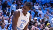 Nov 14, 2025; Chapel Hill, North Carolina, USA; North Carolina Tar Heels forward Caleb Wilson (8) has a laugh on the bench during the second half against the North Carolina Central Eagles at Dean E. Smith Center. Mandatory Credit: Scott Kinser-Imagn Images
