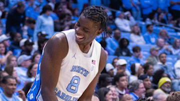 Nov 14, 2025; Chapel Hill, North Carolina, USA; North Carolina Tar Heels forward Caleb Wilson (8) has a laugh on the bench during the second half against the North Carolina Central Eagles at Dean E. Smith Center. Mandatory Credit: Scott Kinser-Imagn Images