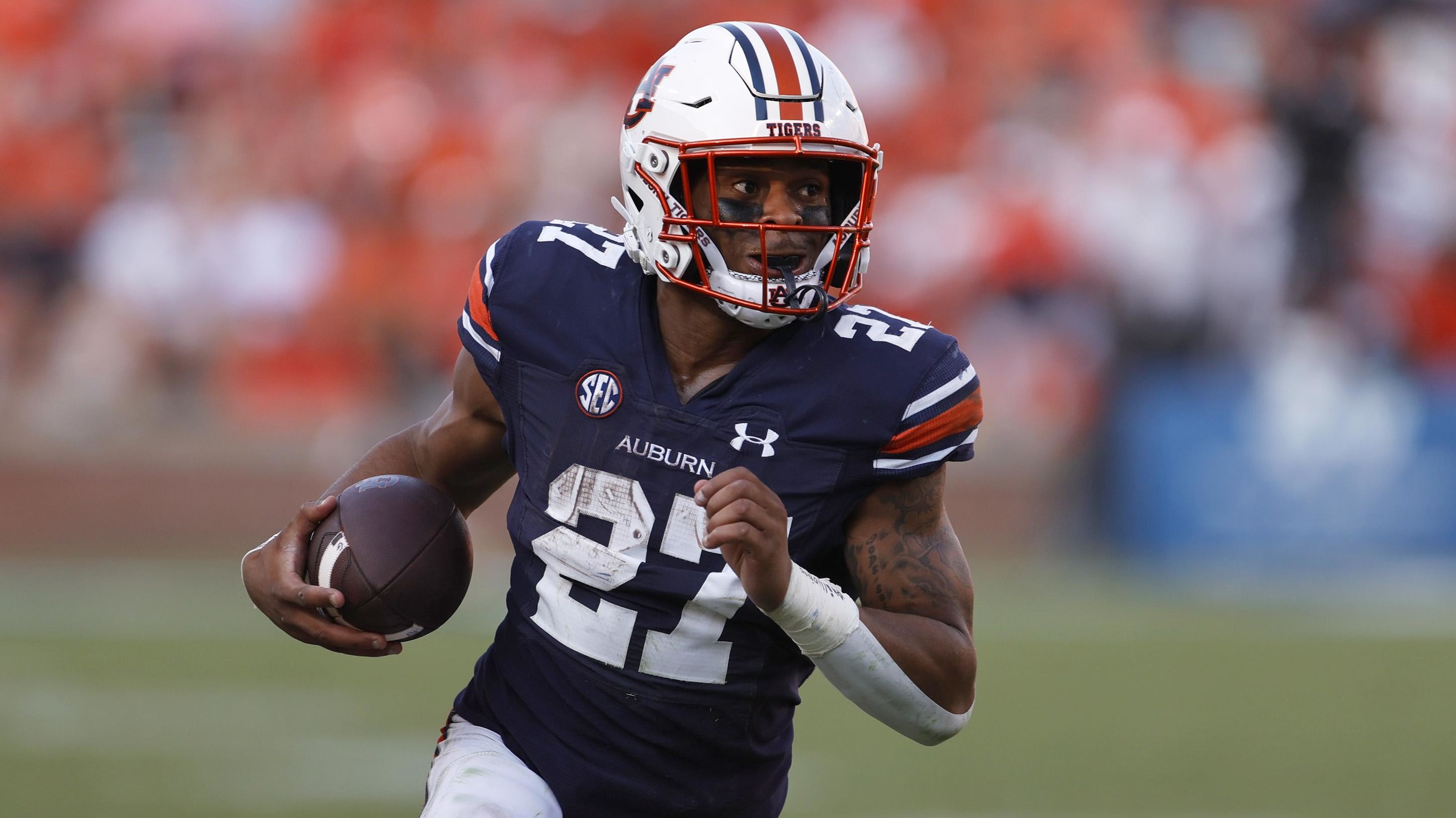 Auburn Tigers running back Jarquez Hunter on a rushing attempt during a college football game in the SEC.