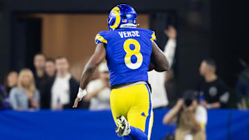 Jan 13, 2025; Glendale, AZ, USA; Los Angeles Rams linebacker Jared Verse (8) returns a fumble for a touchdown against the Minnesota Vikings during an NFC wild card game at State Farm Stadium. Mandatory Credit: Mark J. Rebilas-Imagn Images