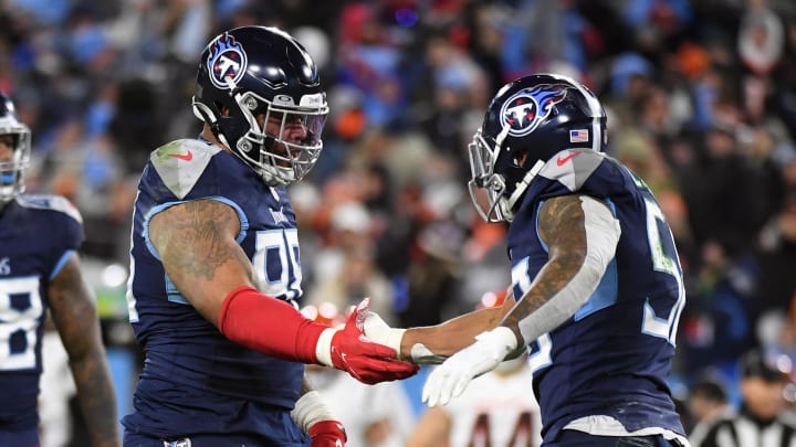 Jan 22, 2022; Nashville, Tennessee, USA; Tennessee Titans defensive end Jeffery Simmons (98) and Tennessee Titans outside linebacker Harold Landry (58) celebrate after a sack during the second half against the Cincinnati Bengals during a AFC Divisional playoff football game at Nissan Stadium. Mandatory Credit: Christopher Hanewinckel-USA TODAY Sports