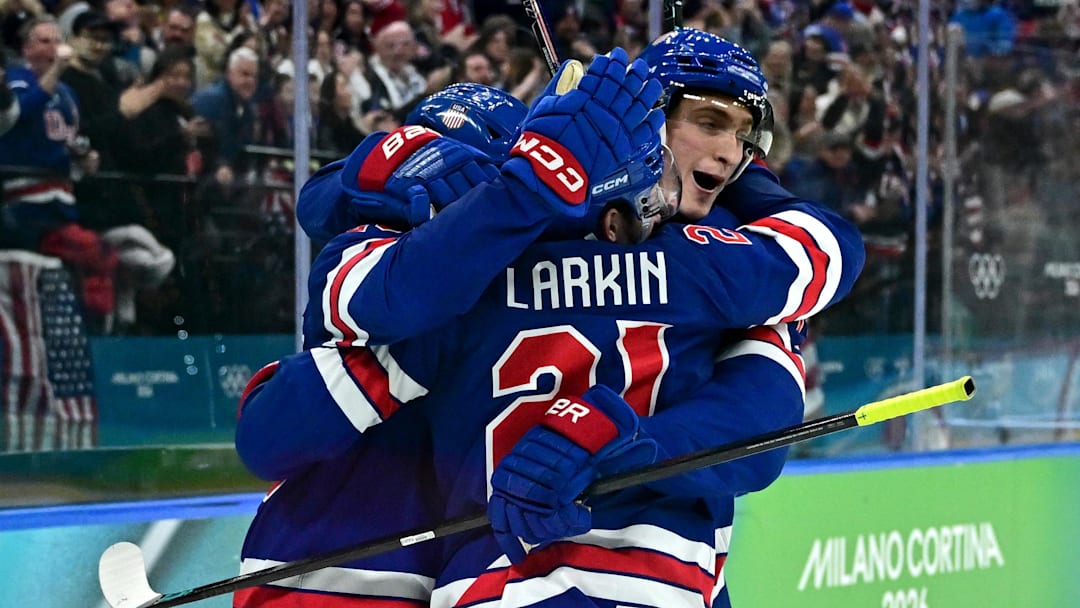 [US, Mexico & Canada customers only] Feb 18, 2026; Milan, Italy; Dylan Larkin of United States celebrates with teammates after scoring their first goal  against Sweden in a men's ice hockey quarterfinal during the Milano Cortina 2026 Olympic Winter Games at Milano Santagiulia Ice Hockey Arena. Mandatory Credit: Marton Monus/Reuters via Imagn Images