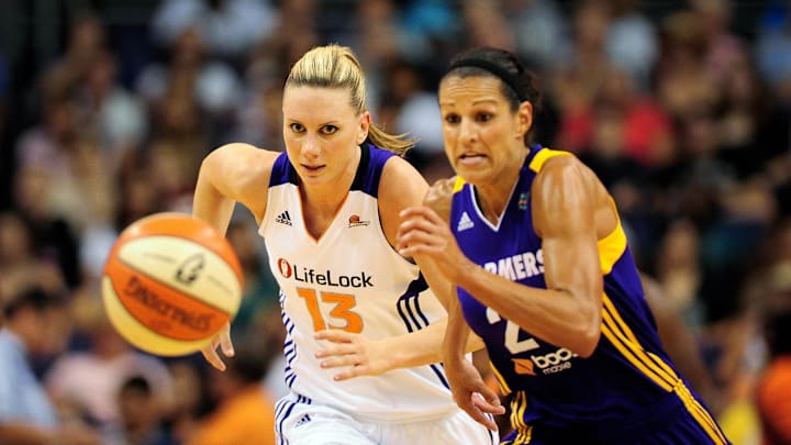 Sep 3, 2011; Phoenix, AZ, USA; Phoenix Mercury forward Penny Taylor (13) and Los Angeles Sparks guard Ticha Penicheiro (21) chase after a loose ball during the first half at the US Airways Center.  Mandatory Credit: Jennifer Stewart-Imagn Images