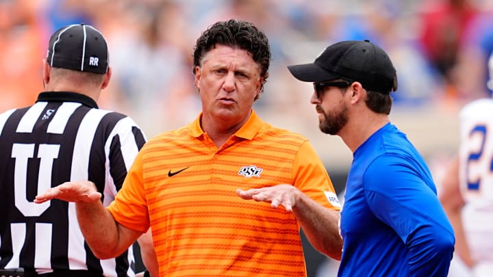 Oklahoma State head coach Mike Gundy talks with South Dakota State head coach Jimmy Rogers before the college football game between the Oklahoma State Cowboys and South Dakota State Jackrabbits at Boone Pickens Stadium in Stillwater, Okla., Saturday, Aug., 31, 2024.