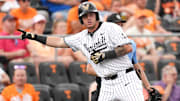 Vanderbilt infielder Braden Holcomb (26) gestures to the Vanderbilt dugout after hitting a triple during a NCAA baseball game between the Tennessee Volunteers and Vanderbilt Commodores at Lindsey Nelson Stadium on May 11, 2025.