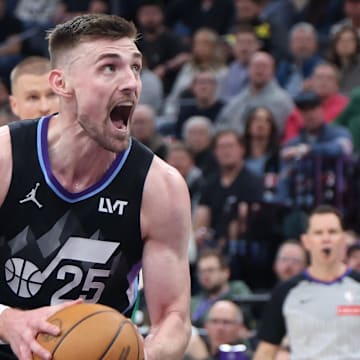 Mar 21, 2025; Salt Lake City, Utah, USA; Utah Jazz center Micah Potter goes to the basket against the Boston Celtics during the second half at Delta Center. Mandatory Credit: Rob Gray-Imagn Images
