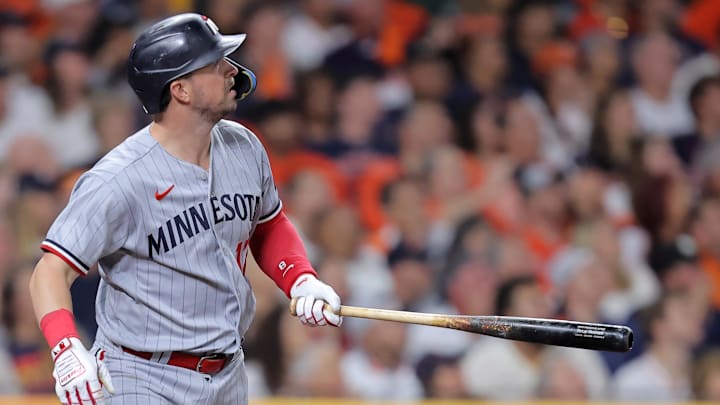 Oct 8, 2023; Houston, Texas, USA; Minnesota Twins third baseman Kyle Farmer (12) hits a two run home run against the Houston Astros in the second inning for game two of the ALDS for the 2023 MLB playoffs at Minute Maid Park. Mandatory Credit: Erik Williams-Imagn Images