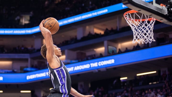 Oct 19, 2023; Sacramento, California, USA; Sacramento Kings forward Kessler Edwards (17) dunks the ball during the second quarter against the Utah Jazz at Golden 1 Center. Mandatory Credit: Ed Szczepanski-USA TODAY Sports