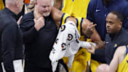 Jun 22, 2025; Oklahoma City, Oklahoma, USA; Indiana Pacers guard Tyrese Haliburton (0) is assisted after an apparent injury following a play against the Oklahoma City Thunder during the first half of game seven of the 2025 NBA Finals at Paycom Center. Mandatory Credit: Alonzo Adams-Imagn Images