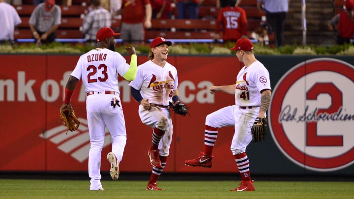 Aug 15, 2018; St. Louis, MO, USA; St. Louis Cardinals center fielder Harrison Bader (48) left fielder Marcell Ozuna (23) and right fielder Tyler O'Neill (41) celebrate after the Cardinals defeated the Washington Nationals at Busch Stadium. Mandatory Credit: Jeff Curry-USA TODAY Sports