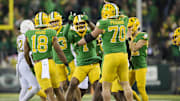 Nov 9, 2024; Eugene, Oregon, USA; Oregon Ducks defensive end Jordan Burch (1) celebrates after intercepting a pass during the second half against the Maryland Terrapins at Autzen Stadium.