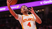 Dec 2, 2024; Atlanta, Georgia, USA; Atlanta Hawks guard Kobe Bufkin (4) shoots against the New Orleans Pelicans in the second quarter at State Farm Arena. Mandatory Credit: Brett Davis-Imagn Images
