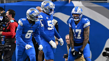 Former Detroit Lions wide receiver Tim Patrick (17) celebrates with offensive tackle Penei Sewell (58) and wide receiver Allen Robinson (8) after catching a touchdown pass at Ford Field.