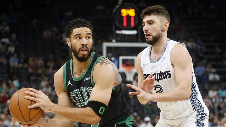 Mar 20, 2026; Memphis, Tennessee, USA; Boston Celtics forward Jayson Tatum (0) handles the ball as Memphis Grizzlies guard Ty Jerome (2) defends during the first quarter at FedExForum. Mandatory Credit: Petre Thomas-Imagn Images