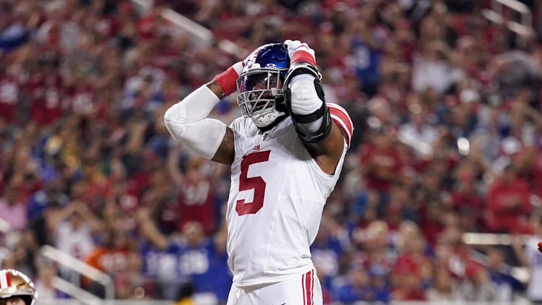 Sep 21, 2023; Santa Clara, California, USA; New York Giants linebacker Kayvon Thibodeaux (5) reacts next to safety Isaiah Simmons (19) and San Francisco 49ers tight end George Kittle (85) after the Giants were called for a penalty in the third quarter at Levi's Stadium. Mandatory Credit: Cary Edmondson-Imagn Images