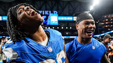 Detroit Lions running back Jahmyr Gibbs (26) and running back David Montgomery (5) celebrate 34-31 win over Packers