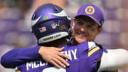 Aug 10, 2024; Minneapolis, Minnesota, USA;  Minnesota Vikings quarterback J.J. McCarthy (9) and head coach Kevin O'Connell react before the game against the Las Vegas Raiders at U.S. Bank Stadium.