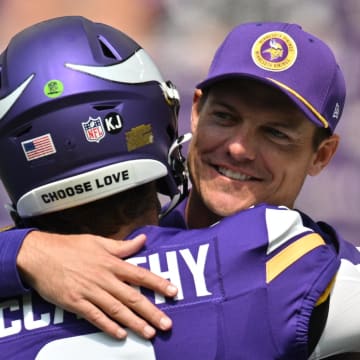 Aug 10, 2024; Minneapolis, Minnesota, USA;  Minnesota Vikings quarterback J.J. McCarthy (9) and head coach Kevin O'Connell react before the game against the Las Vegas Raiders at U.S. Bank Stadium.