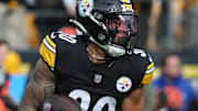 Nov 16, 2025; Pittsburgh, Pennsylvania, USA;  Pittsburgh Steelers running back Jaylen Warren (30) runs the ball against the Cincinnati Bengals during the first quarter at Acrisure Stadium. 