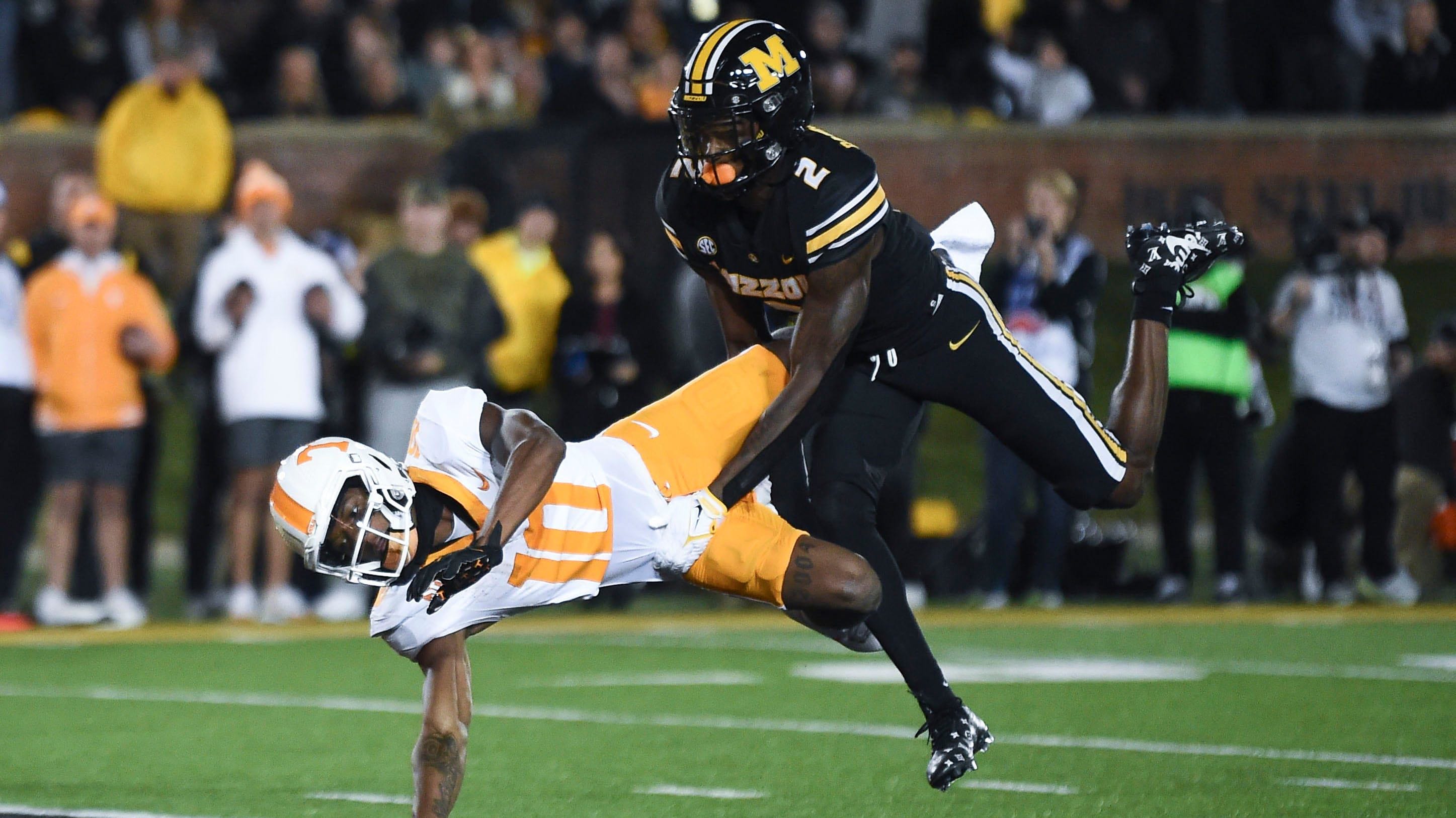 The ball is thrown past Tennessee wide receiver Squirrel White (10) while covered by Missouri cornerback Ennis Rakestraw (2).