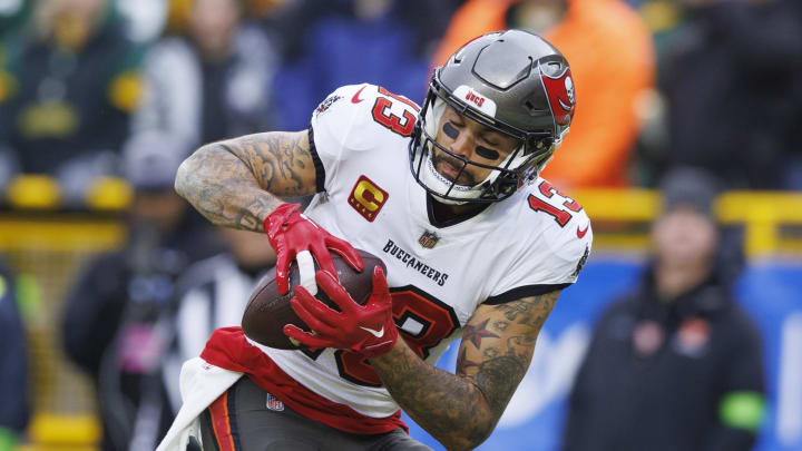 Dec 17, 2023; Green Bay, Wisconsin, USA;  Tampa Bay Buccaneers wide receiver Mike Evans (13) catches a pass to score a touchdown during the second quarter against the Green Bay Packers at Lambeau Field. Mandatory Credit: Jeff Hanisch-USA TODAY Sports