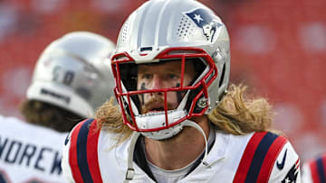 Aug 25, 2024; Landover, Maryland, USA;  New England Patriots safety Brenden Schooler (41) enter the field before the game against the Washington Commanders at Commanders Field. Mandatory Credit: Tommy Gilligan-Imagn Images
