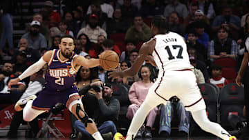 Feb 12, 2025; Houston, Texas, USA; Phoenix Suns guard Tyus Jones (21) steals the ball from Houston Rockets forward Tari Eason (17) in the first quarter at Toyota Center. Mandatory Credit: Thomas Shea-Imagn Images