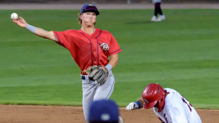 Cedar Rapids second baseman Luke Keaschall attempts a double play after the forced out on Peoria's Jeremy Rivas in the fifth inning of the Midwest League West Division Championship Series on Tuesday, Sept. 12, 2023 at Dozer Park in Peoria.