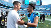 Sep 21, 2025; Charlotte, North Carolina, USA; Carolina Panthers head coach Dave Canales with quarterback Bryce Young (9) after the game at Bank of America Stadium. 