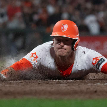 May 28, 2024; San Francisco, California, USA;  San Francisco Giants shortstop Tyler Fitzgerald (49) slides into home plate to defeat the Philadelphia Phillies at Oracle Park.