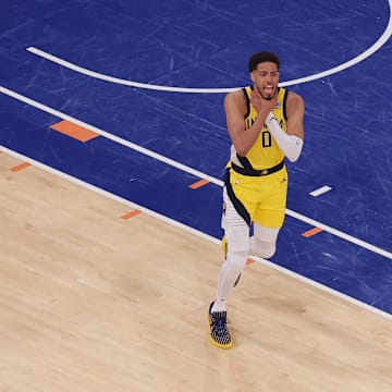 May 21, 2025; New York, New York, USA; Indiana Pacers guard Tyrese Haliburton (0) reacts after tying the game in the fourth quarter to send the game to overtime against the New York Knicks during game one of the eastern conference finals for the 2025 NBA Playoffs at Madison Square Garden. Mandatory Credit: Brad Penner-Imagn Images