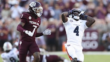 Sep 27, 2025; College Station, Texas, USA; Auburn Tigers wide receiver Malcolm Simmons (4) reacts as Texas A&M Aggies cornerback Tyreek Chappell (7) defends during the fourth quarter at Kyle Field. Mandatory Credit: Troy Taormina-Imagn Images