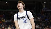 Nov 8, 2025; Washington, District of Columbia, USA; Dallas Mavericks forward Cooper Flagg (32) reacts after a dunk against the Washington Wizards in the first half at Capital One Arena. Mandatory Credit: Geoff Burke-Imagn Images