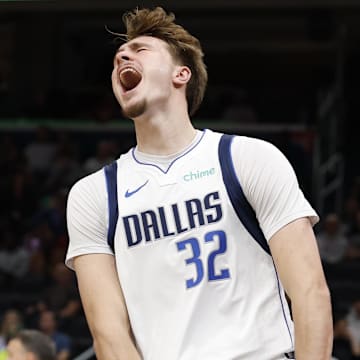 Nov 8, 2025; Washington, District of Columbia, USA; Dallas Mavericks forward Cooper Flagg (32) reacts after a dunk against the Washington Wizards in the first half at Capital One Arena. Mandatory Credit: Geoff Burke-Imagn Images
