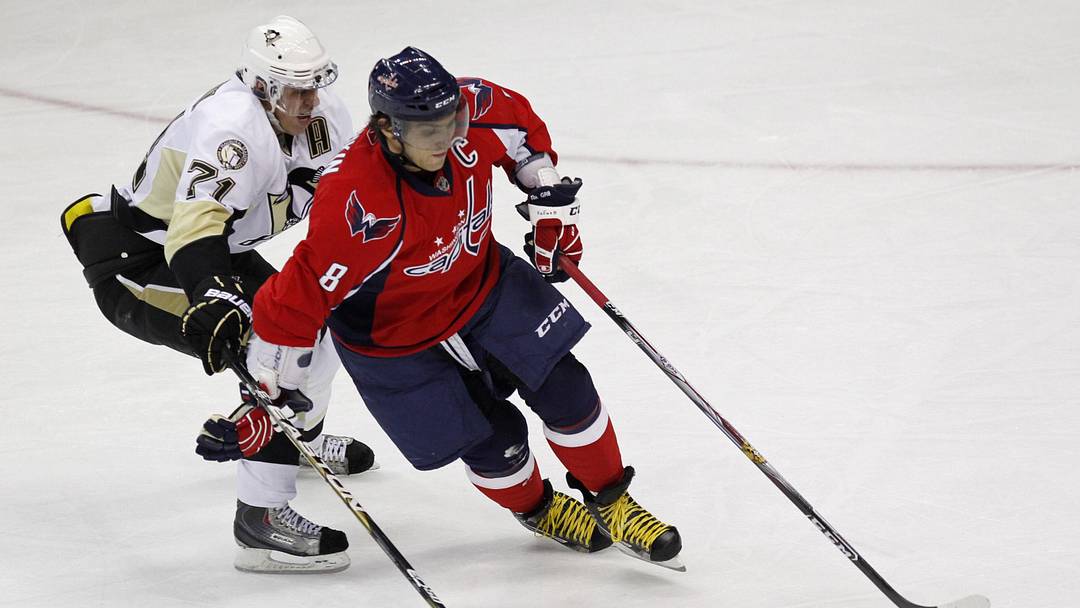 December 23, 2010; Washington, DC, USA; Washington Capitals left wing Alex Ovechkin (8) skates with the puck against Pittsburgh Penguins center Evgeni Malkin (71) in the first period at Verizon Center. Mandatory Credit: Geoff Burke-Imagn Images