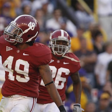 November 8, 2008; Baton Rouge, LA, USA; Alabama Crimson Tide defensive back Rashad Johnson (49) carries the ball into the end zone after intercepting the ball from the LSU Tigers during the first half at Tiger Stadium in Baton Rouge. 