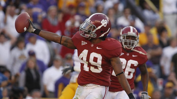 November 8, 2008; Baton Rouge, LA, USA; Alabama Crimson Tide defensive back Rashad Johnson (49) carries the ball into the end zone after intercepting the ball from the LSU Tigers during the first half at Tiger Stadium in Baton Rouge. 