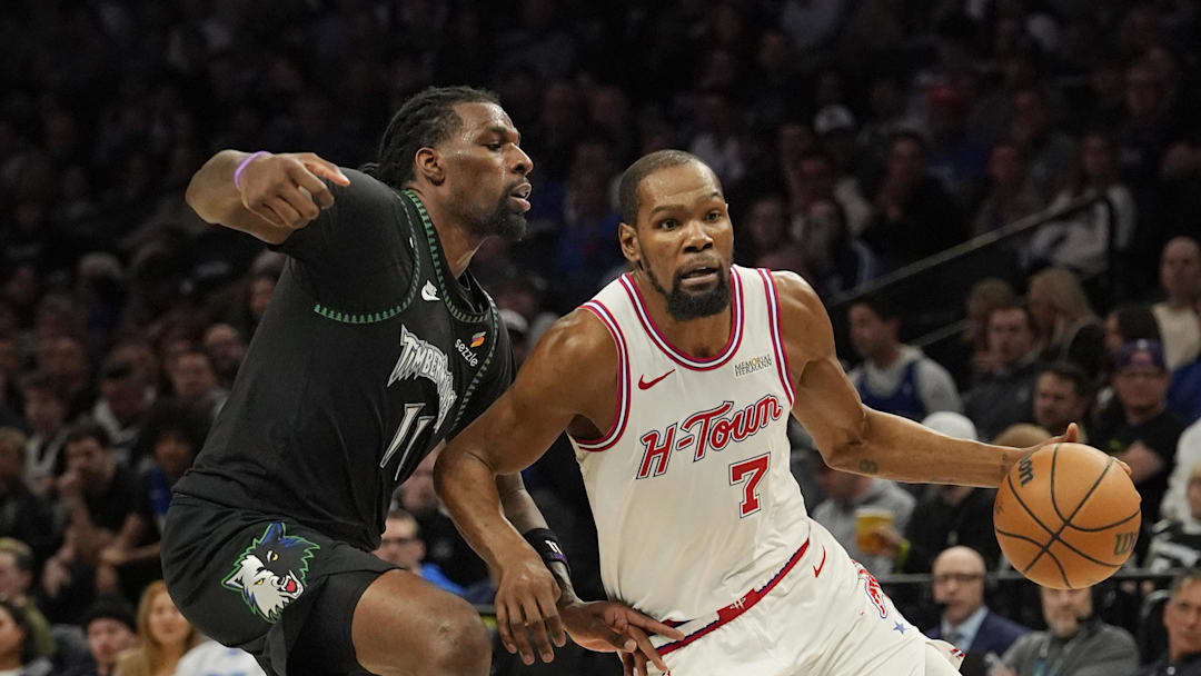 Mar 25, 2026; Minneapolis, Minnesota, USA; Houston Rockets forward Kevin Durant (7) works around Minnesota Timberwolves center Naz Reid (11) in the third quarter at Target Center. Mandatory Credit: Bruce Kluckhohn-Imagn Images