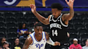 Oct 19, 2025; Pittsburgh, PA, USA;  Pittsburgh Panthers guard Damarco Minor (7) brings the ball up court against  Providence Friars guard Corey Floyd Jr. (14) during the first half at the Petersen Events Center. Mandatory Credit: Charles LeClaire-Imagn Images