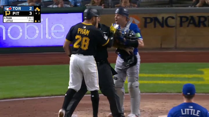 Pittsburgh Pirates outfielder Tommy Pham and Toronto Blue Jays catcher Tyler Heineman argue at home plate.