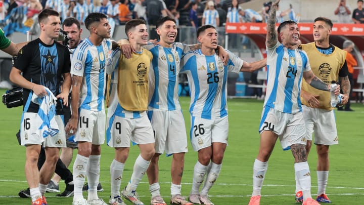 Jul 9, 2024; East Rutherford, NJ, USA;  Argentina midfielder Enzo Fernandez (24) celebrates with teammates  after defeating Canada at Metlife Stadium. Mandatory Credit: Vincent Carchietta-USA TODAY Sports