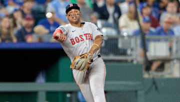 Aug 6, 2024; Kansas City, Missouri, USA; Boston Red Sox third base Rafael Devers (11) throws to first base during the eighth inning Kansas City Royals at Kauffman Stadium. Mandatory Credit: William Purnell-Imagn Images