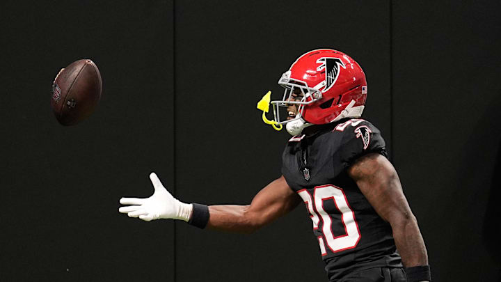 Oct 13, 2025; Atlanta, Georgia, USA;  Atlanta Falcons cornerback Dee Alford (20) flips the ball into the stands after an interception against the Buffalo Bills during the first half of a game at Mercedes-Benz Stadium. Mandatory Credit: Dale Zanine-Imagn Images