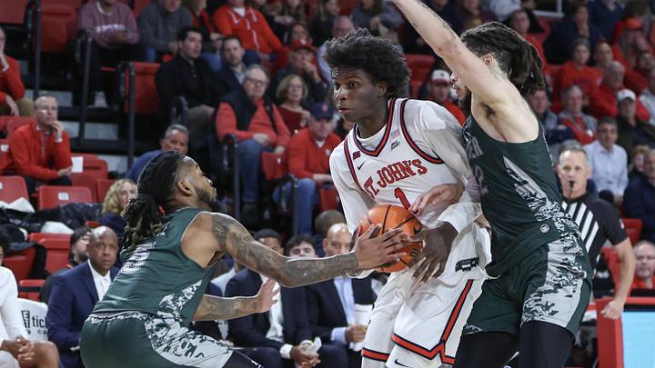 Nov 13, 2024; Queens, New York, USA;  St. John's basketball guard Kadary Richmond (1) looks to drive past Wagner Seahawks guards Zae Blake (5) and Zaire Williams (12) in the second half at Carnesecca Arena.