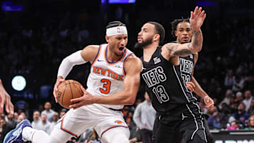 Jan 21, 2025; Brooklyn, New York, USA;  New York Knicks guard Josh Hart (3) looks to drive past Brooklyn Nets guard Tyrese Martin (13) in the second quarter at Barclays Center. Mandatory Credit: Wendell Cruz-Imagn Images