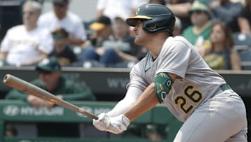 Jun 7, 2023; Pittsburgh, Pennsylvania, USA;  Oakland Athletics third baseman Jonah Bride (26) hits an RBI single against the Pittsburgh Pirates during the first inning at PNC Park. Mandatory Credit: Charles LeClaire-Imagn Images