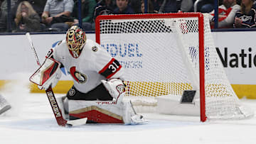 Apr 8, 2025; Columbus, Ohio, USA; Ottawa Senators goalie Anton Forsberg (31) makes a stick save against the Columbus Blue Jackets during the first period at Nationwide Arena. Mandatory Credit: Russell LaBounty-Imagn Images