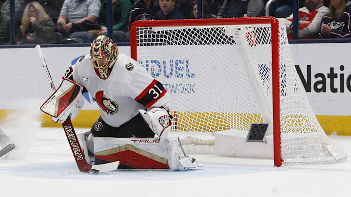 Apr 8, 2025; Columbus, Ohio, USA; Ottawa Senators goalie Anton Forsberg (31) makes a stick save against the Columbus Blue Jackets during the first period at Nationwide Arena. Mandatory Credit: Russell LaBounty-Imagn Images